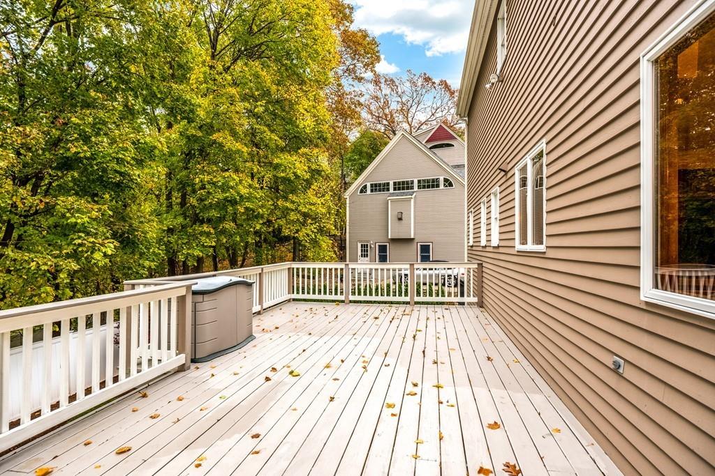 2 Alben Street Winchester, MA 01890 - Photo 16 of 33 a view of a balcony with wooden floor and fence