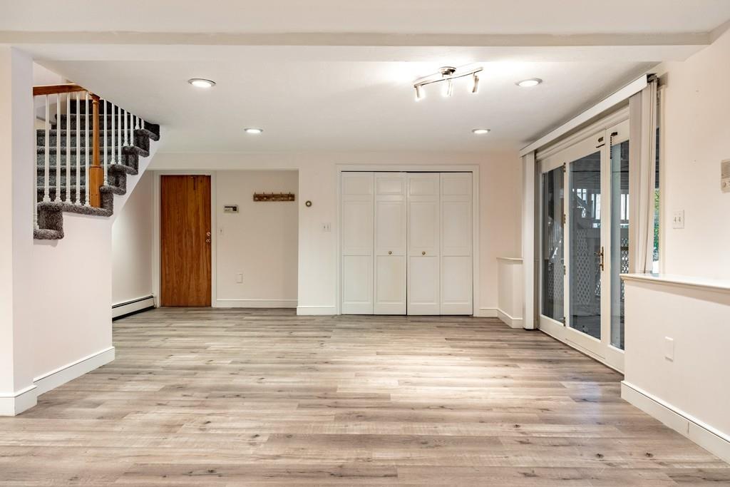 2 Alben Street Winchester, MA 01890 - Photo 27 of 33 a view of a livingroom with a staircase