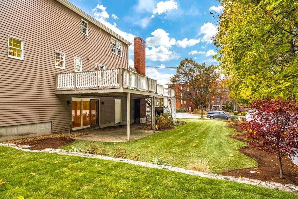 2 Alben Street Winchester, MA 01890 - Photo 29 of 33 a view of a house with a yard and garage