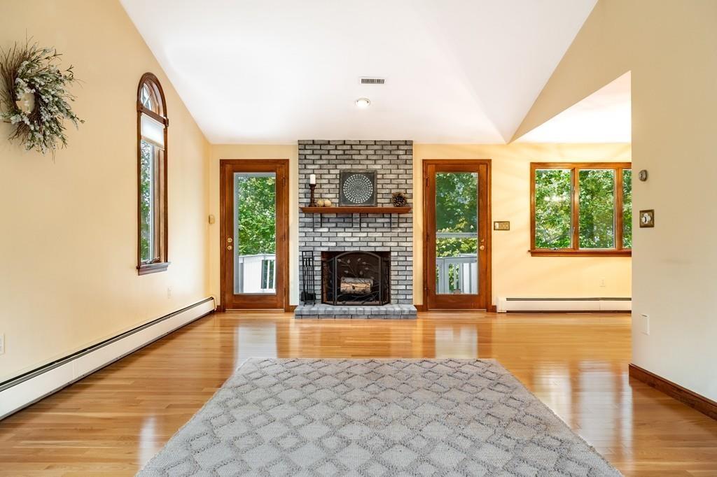 2 Alben Street Winchester, MA 01890 - Photo 4 of 33 a view of a livingroom with a fireplace and window