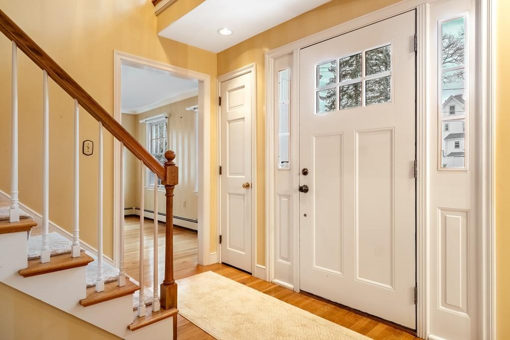 2 Alben Street Winchester, MA 01890 - Photo 6 of 33 a view of a hallway with wooden floor and staircase