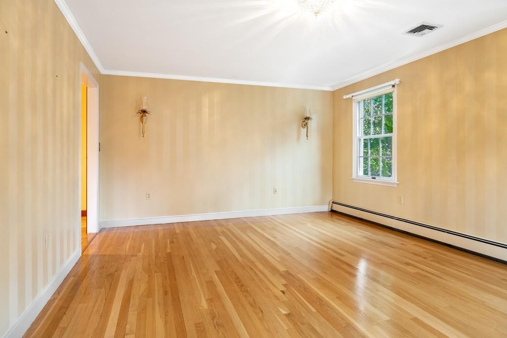 2 Alben Street Winchester, MA 01890 - Photo 7 of 33 a view of an empty room with wooden floor and a window