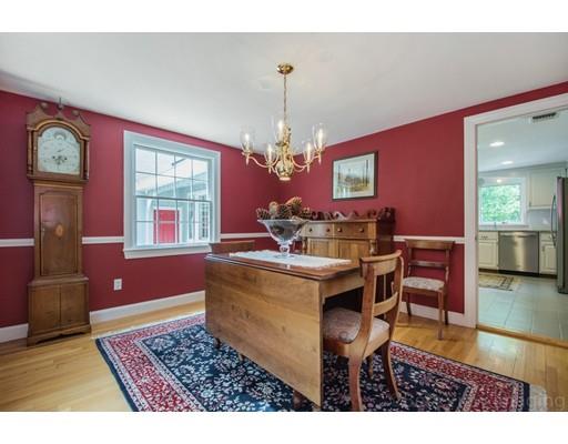 8 Jefferson Drive Acton, MA 01720 - Photo 11 of 38 a view of a dining room with furniture and chandelier