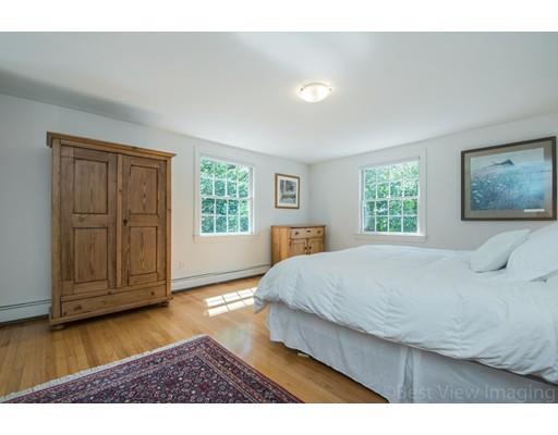 8 Jefferson Drive Acton, MA 01720 - Photo 15 of 38 a bedroom with a bed and wooden floor