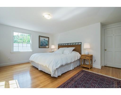 8 Jefferson Drive Acton, MA 01720 - Photo 16 of 38 a bedroom with a bed and wooden floor