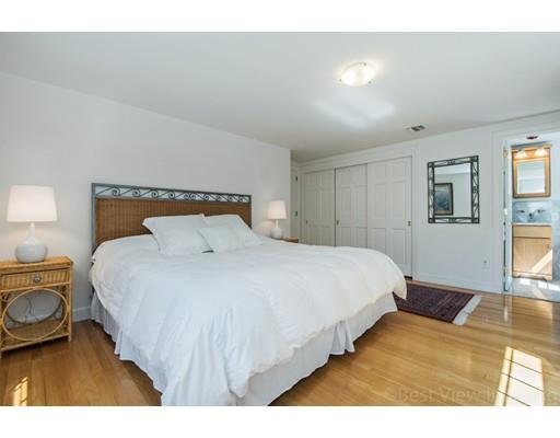 8 Jefferson Drive Acton, MA 01720 - Photo 17 of 38 a bedroom with a bed and wooden floor