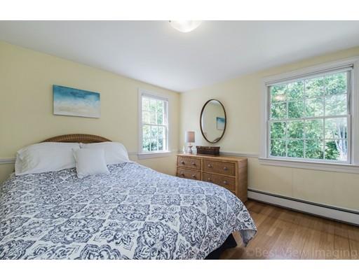 8 Jefferson Drive Acton, MA 01720 - Photo 18 of 38 a bedroom with a large bed and a window