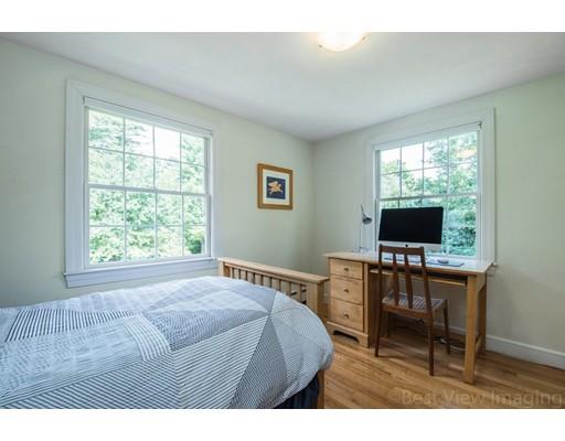 8 Jefferson Drive Acton, MA 01720 - Photo 19 of 38 a bedroom with a bed and a flat screen tv