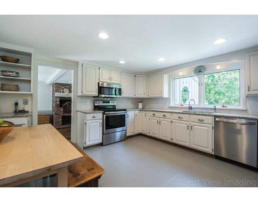 8 Jefferson Drive Acton, MA 01720 - Photo 2 of 38 a kitchen with stainless steel appliances kitchen island granite countertop a stove sink and cabinets