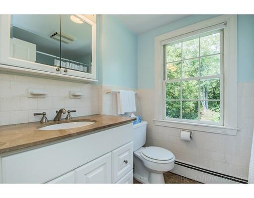 8 Jefferson Drive Acton, MA 01720 - Photo 21 of 38 a bathroom with a granite countertop sink toilet a mirror and window
