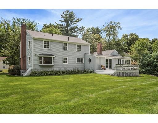 8 Jefferson Drive Acton, MA 01720 - Photo 26 of 38 a front view of a house with garden