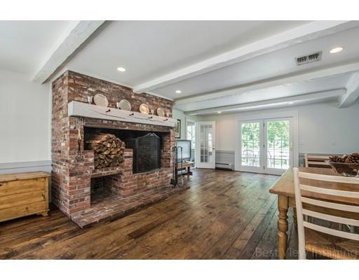 8 Jefferson Drive Acton, MA 01720 - Photo 4 of 38 a living room with furniture and a fireplace
