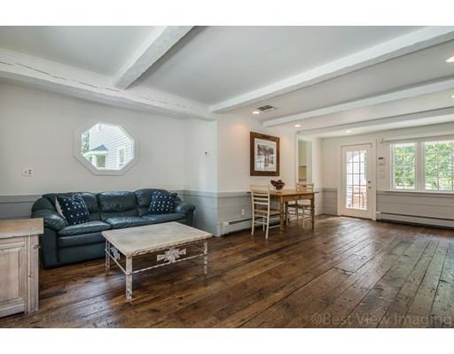 8 Jefferson Drive Acton, MA 01720 - Photo 6 of 38 a living room with furniture and a wooden floor