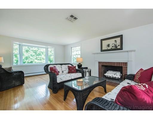 8 Jefferson Drive Acton, MA 01720 - Photo 7 of 38 a living room with furniture a fireplace and a large window