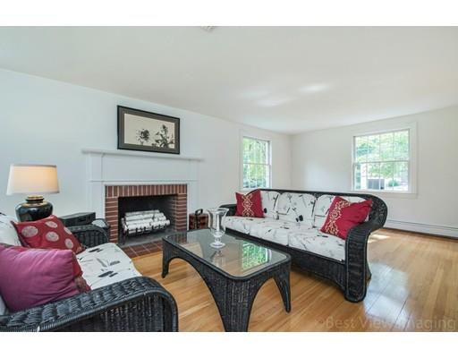 8 Jefferson Drive Acton, MA 01720 - Photo 8 of 38 a living room with furniture and a fireplace