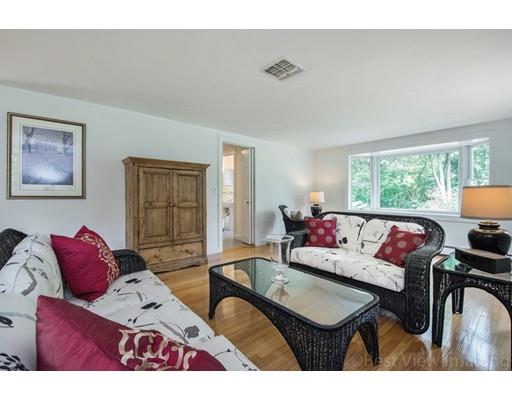 8 Jefferson Drive Acton, MA 01720 - Photo 9 of 38 a living room with furniture and a large window