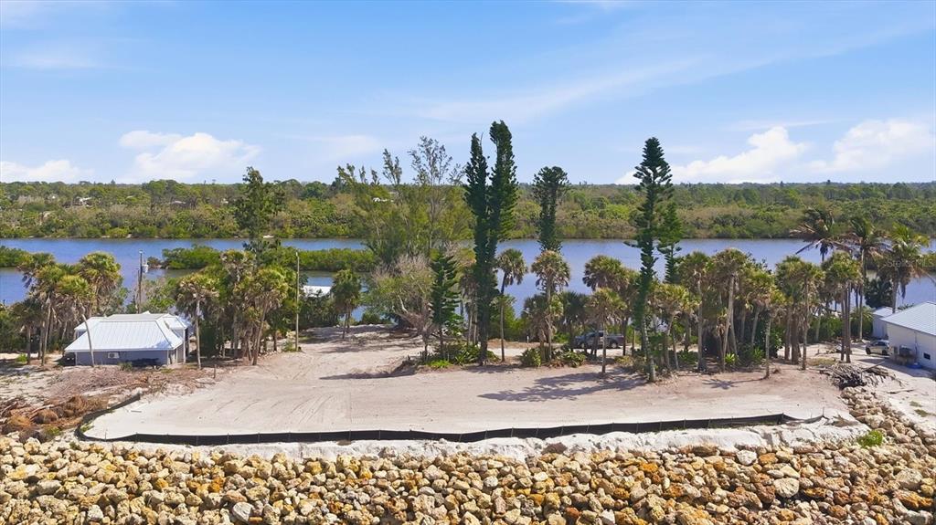804 North Manasota Key Road Englewood, FL 34223 - Photo 13 of 23 a view of a lake and a yard