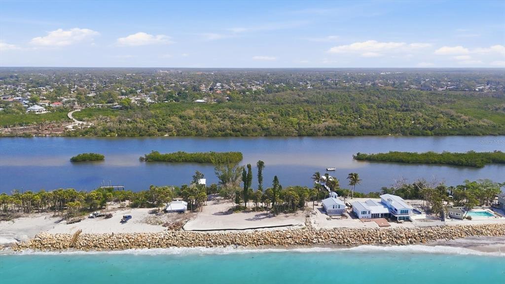 804 North Manasota Key Road Englewood, FL 34223 - Photo 18 of 23 an aerial view of a house with a yard and lake view