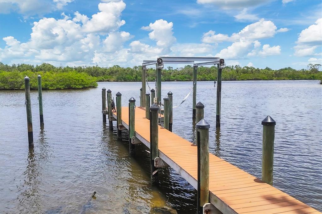 804 North Manasota Key Road Englewood, FL 34223 - Photo 7 of 23 a view of a pathway both side of building