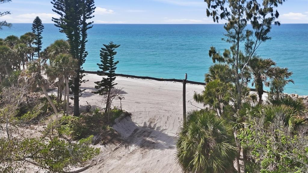 804 North Manasota Key Road Englewood, FL 34223 - Photo 10 of 23 a view of a lake with a tree in a backyard