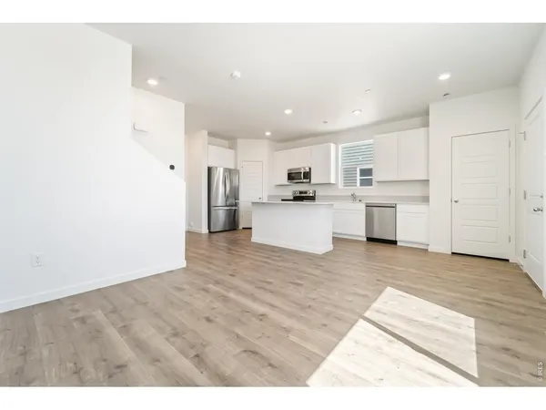a view of kitchen with wooden floor