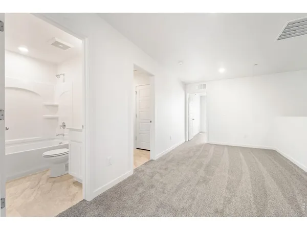 a bathroom with a toilet sink and a bathtub