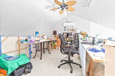 a view of a workspace with furniture