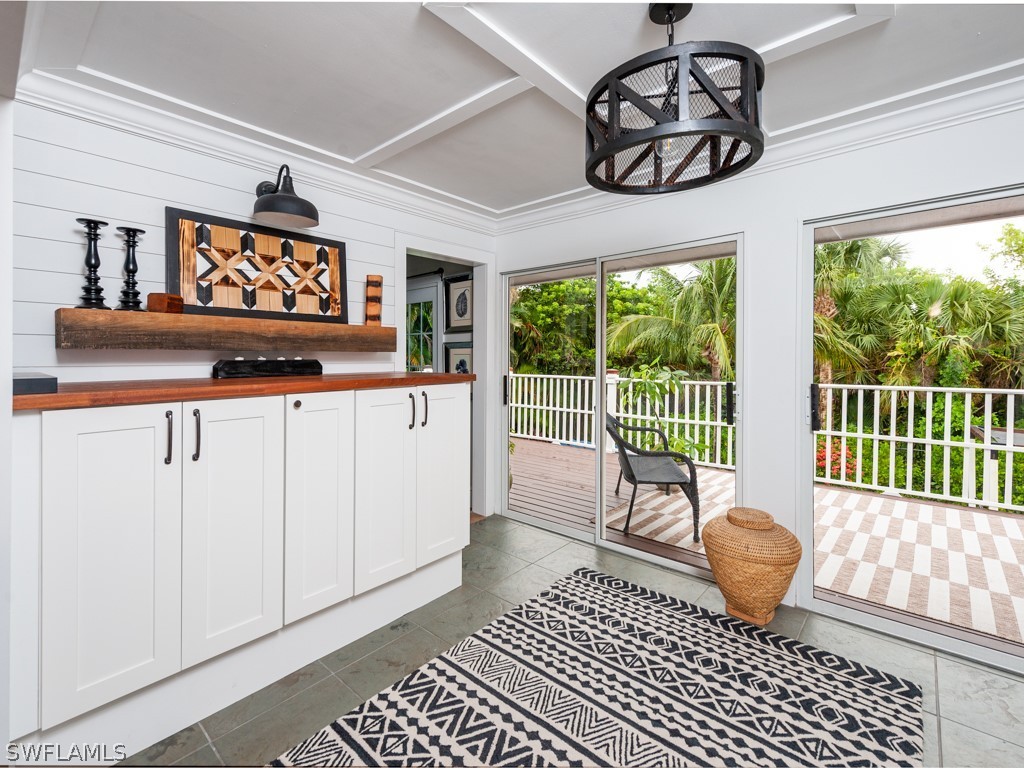 1434 Sand Castle Road Sanibel, FL 33957 - Photo 15 of 35 a outdoor space with wooden floor and a rug