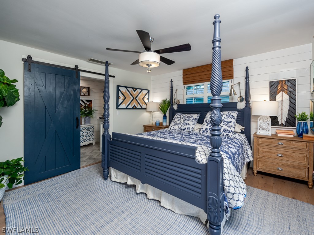 1434 Sand Castle Road Sanibel, FL 33957 - Photo 16 of 35 a bed room with a bed and a dresser