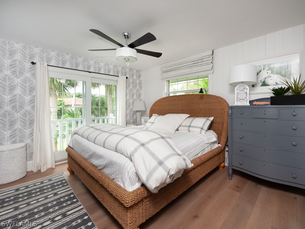 1434 Sand Castle Road Sanibel, FL 33957 - Photo 19 of 35 a bedroom with a bed couch and window