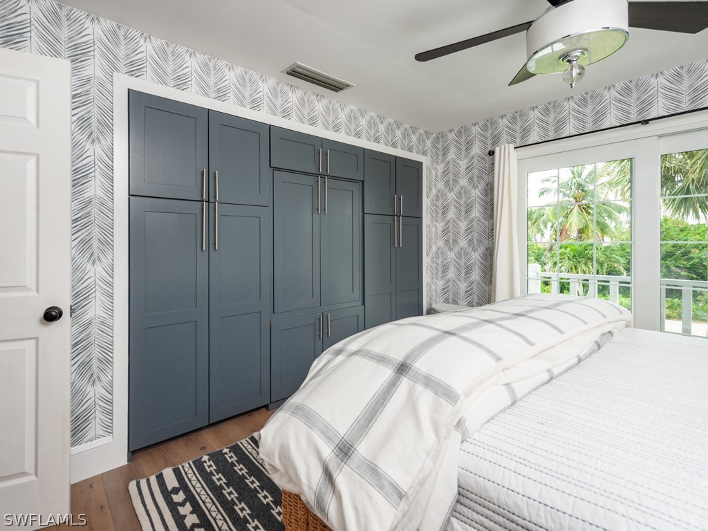 1434 Sand Castle Road Sanibel, FL 33957 - Photo 20 of 35 a bedroom with a bed and a window