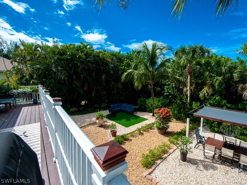 1434 Sand Castle Road Sanibel, FL 33957 - Photo 25 of 35 a view of a backyard with sitting area