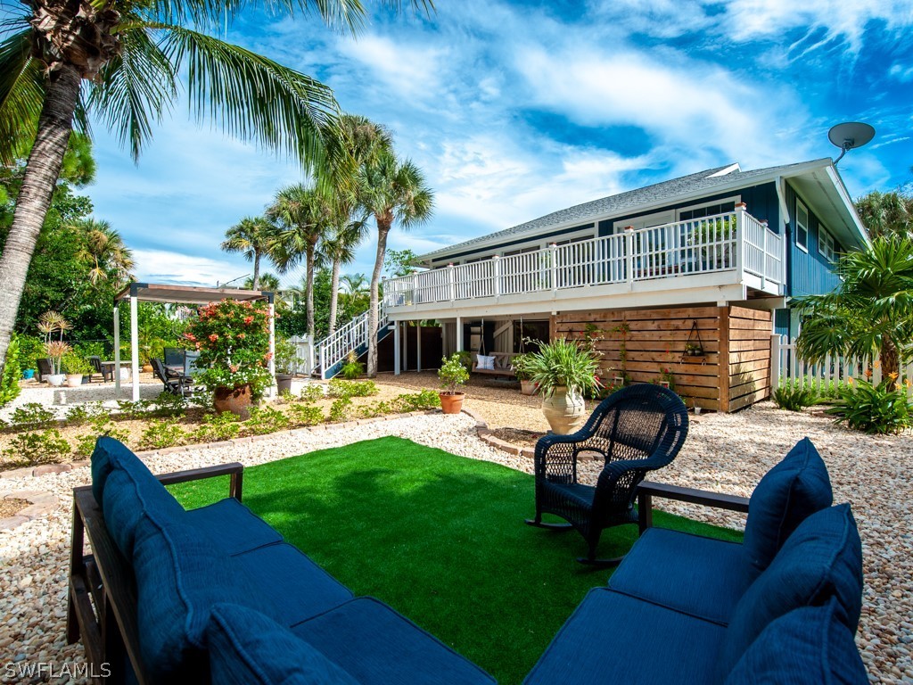 1434 Sand Castle Road Sanibel, FL 33957 - Photo 29 of 35 a view of a house with backyard sitting area and swimming pool