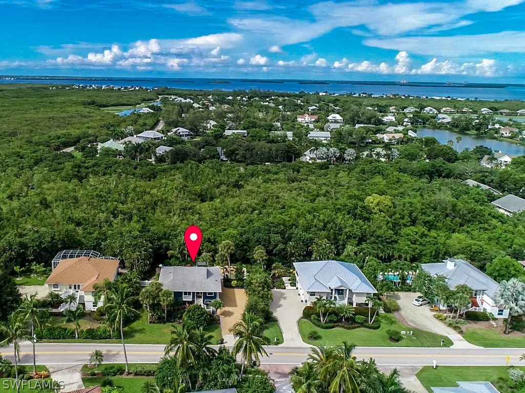 1434 Sand Castle Road Sanibel, FL 33957 - Photo 32 of 35 an aerial view of a house with a yard