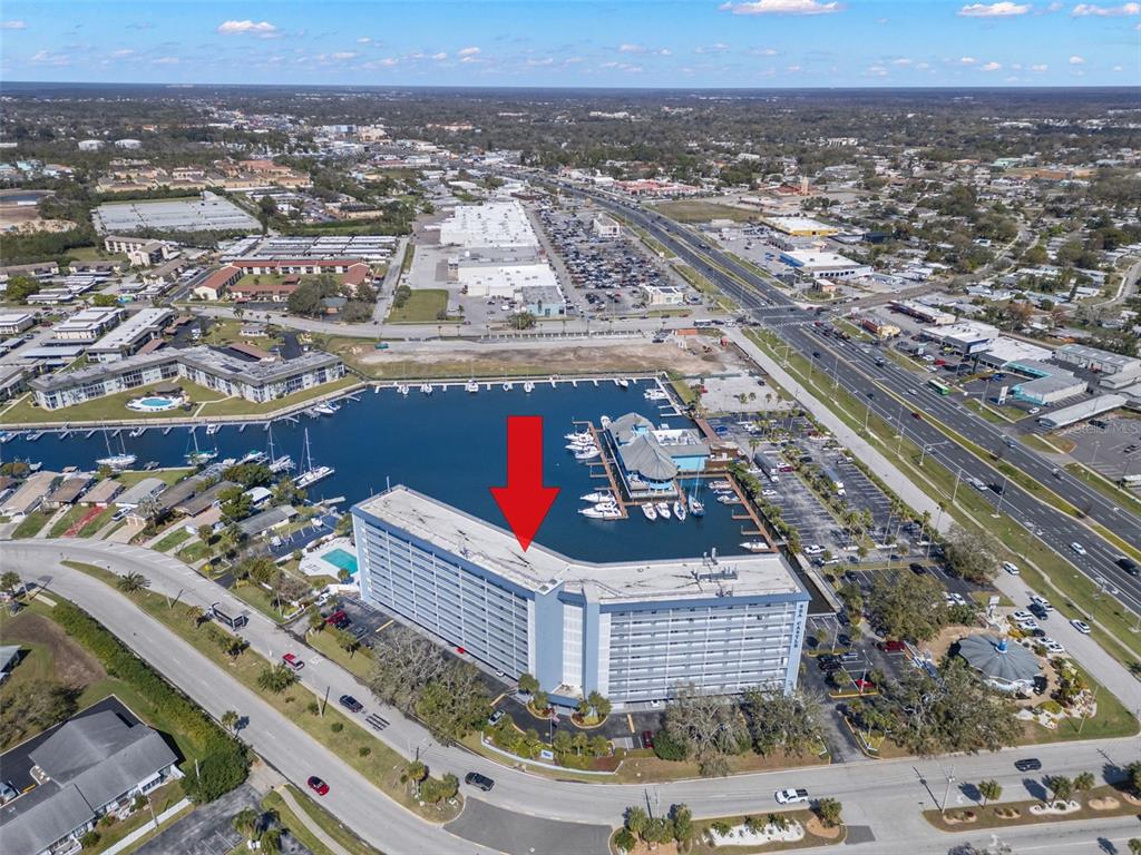 4939 Floramar Terrace, Unit 208 New Port Richey, FL 34652 - Photo 33 of 36 an aerial view of multiple houses