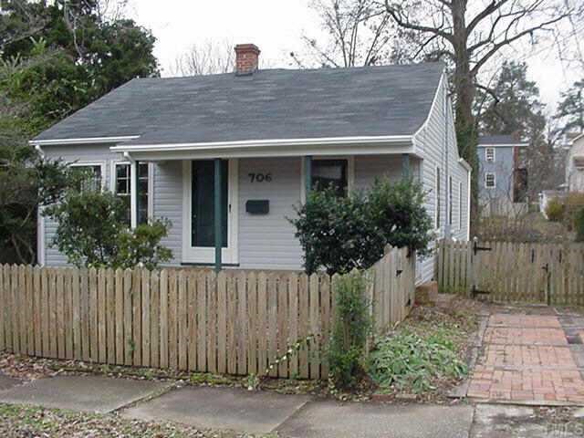 706 Holden Street Raleigh, NC 27604 - Photo 1 of 1 a view of a house with a small yard and plants