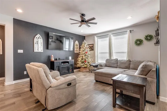 a living room with furniture and a large window