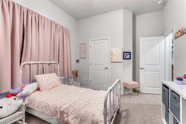 a bedroom with a bed and a chair