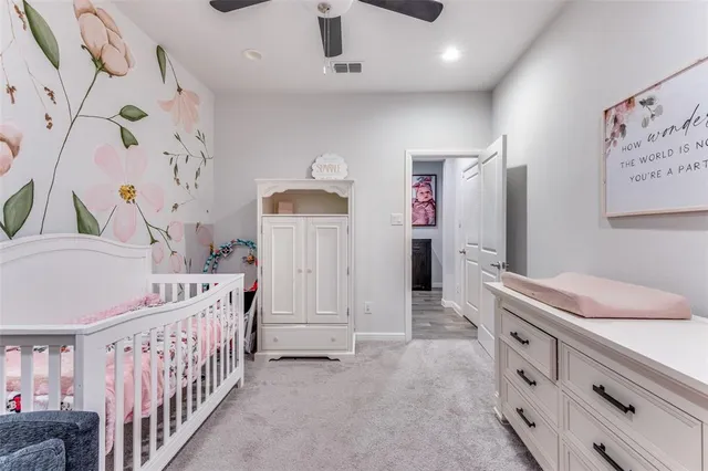 a bedroom with a bed and a flat tv screen