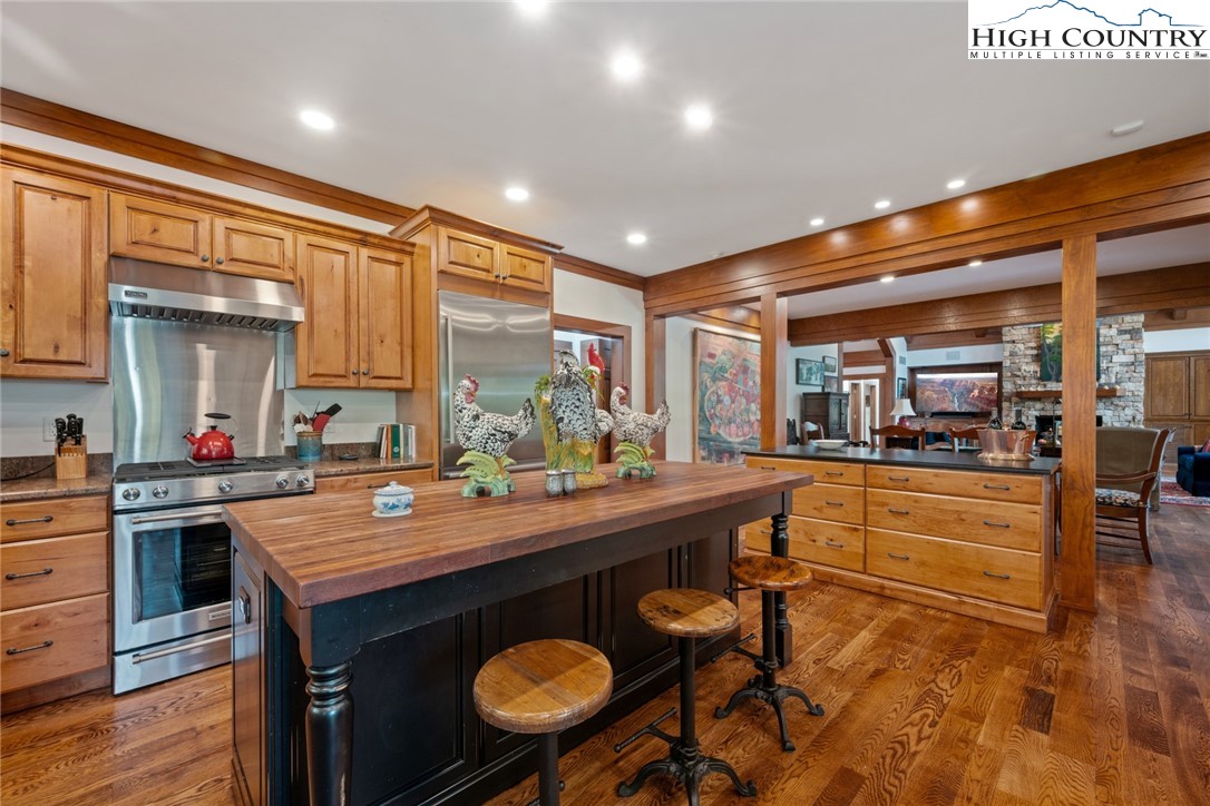 171 Balsam Road Linville, NC 28646 - Photo 11 of 49 a dining hall with stainless steel appliances granite countertop a sink and a white cabinets