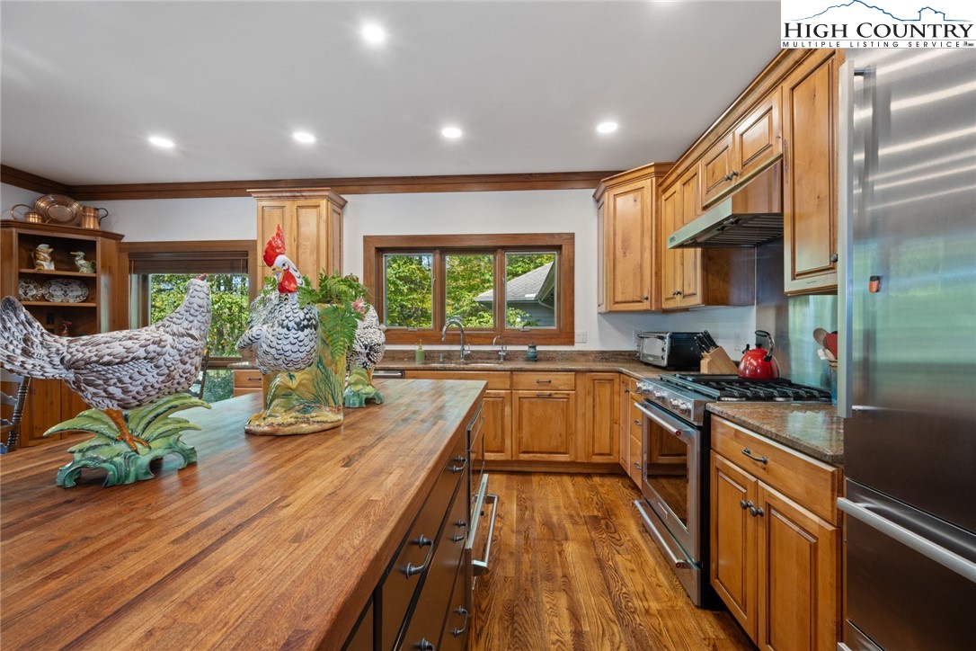 171 Balsam Road Linville, NC 28646 - Photo 12 of 49 a view of a kitchen with kitchen island a large window a sink and counter top space
