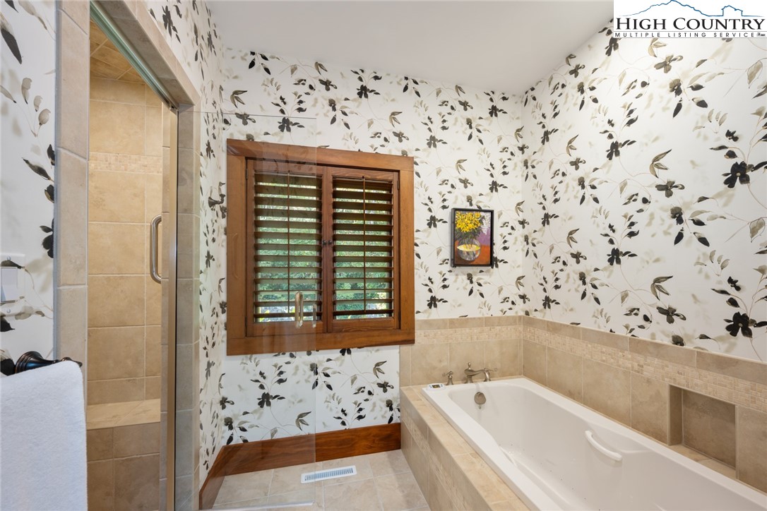 171 Balsam Road Linville, NC 28646 - Photo 24 of 49 a bathroom with a bathtub and shower