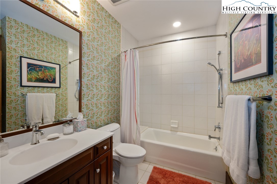 171 Balsam Road Linville, NC 28646 - Photo 29 of 49 a bathroom with a double vanity sink toilet and shower