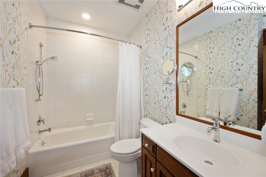 171 Balsam Road Linville, NC 28646 - Photo 31 of 49 a bathroom with a sink mirror toilet and bathtub