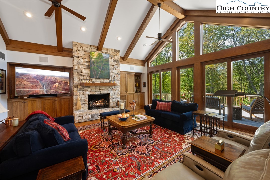 171 Balsam Road Linville, NC 28646 - Photo 5 of 49 a living room with furniture fireplace and a large window