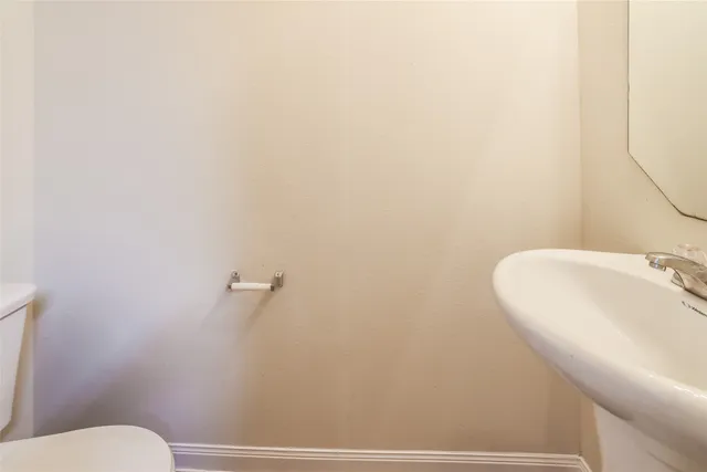 a bathroom with a toilet and a sink