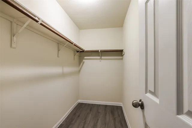 a view of a room with wooden floor and small staircase