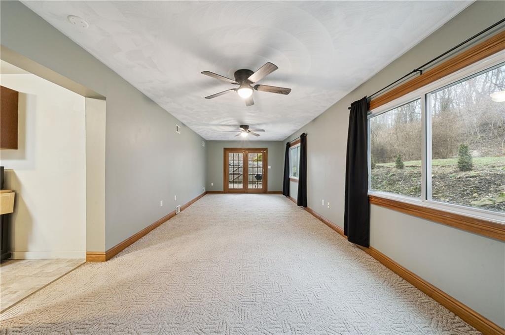 2052 McKinney Road Monroeville, PA 15146 - Photo 11 of 30 a view of a livingroom with a ceiling fan and window