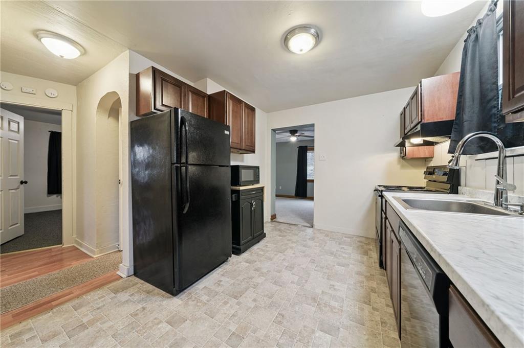 2052 McKinney Road Monroeville, PA 15146 - Photo 13 of 30 a kitchen with stainless steel appliances granite countertop a refrigerator and a sink