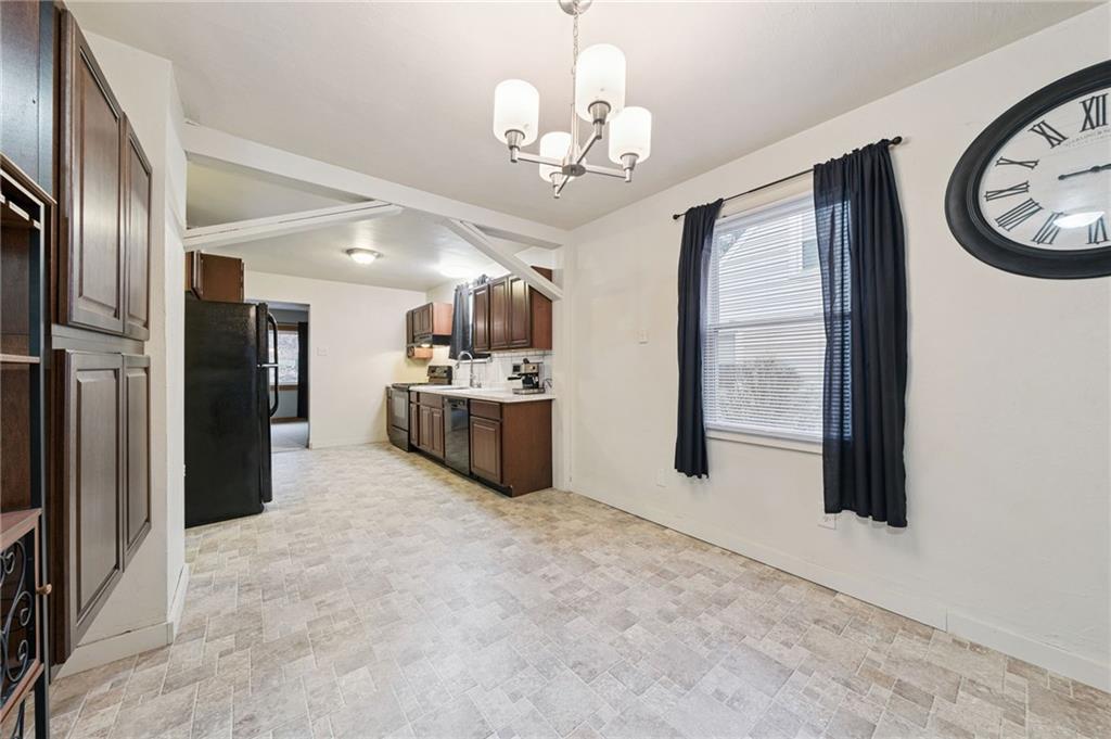 2052 McKinney Road Monroeville, PA 15146 - Photo 16 of 30 a view of a kitchen with stainless steel appliances granite countertop a refrigerator and a stove top oven